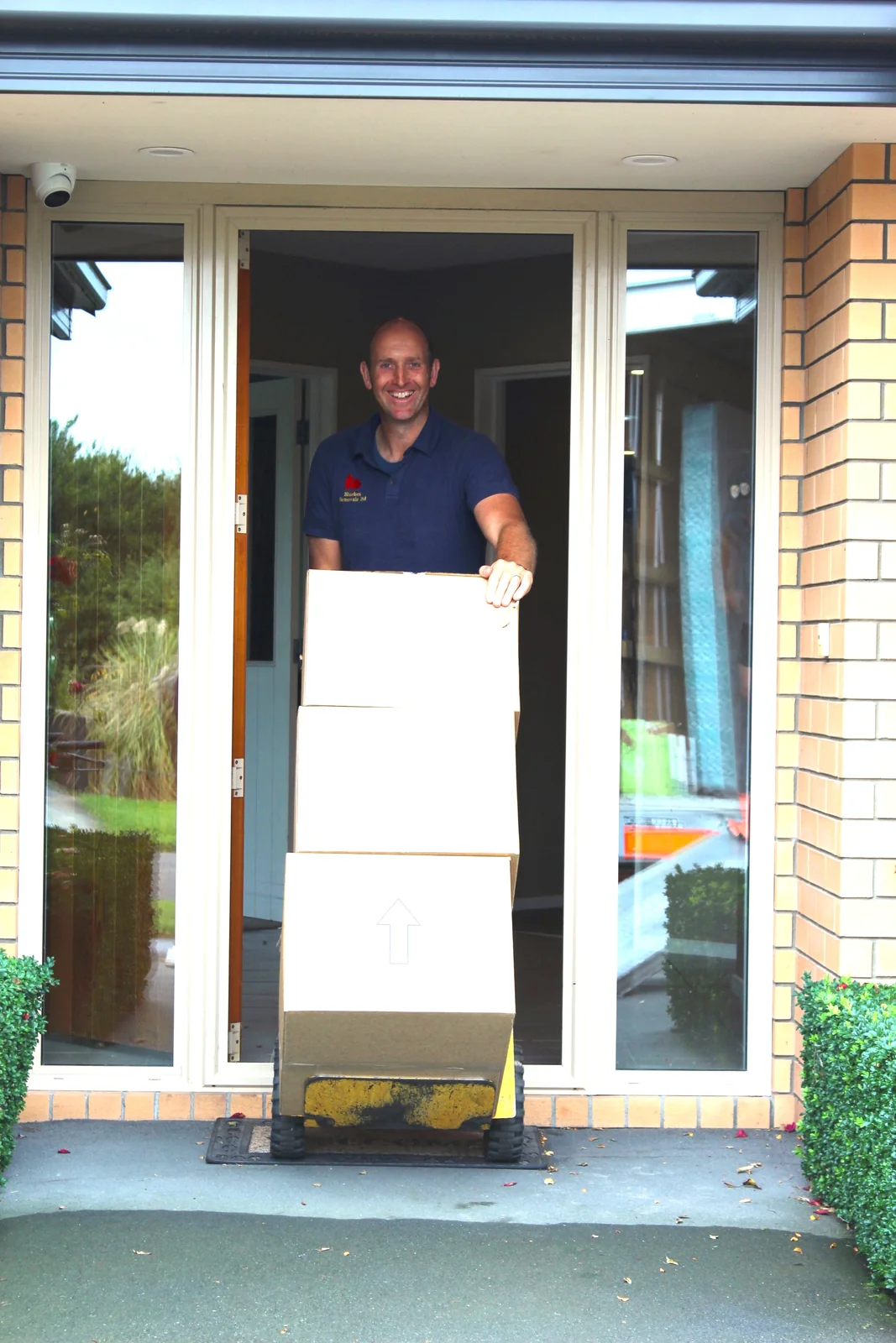 Glen from Bluebox moving boxes from a Canterbury home